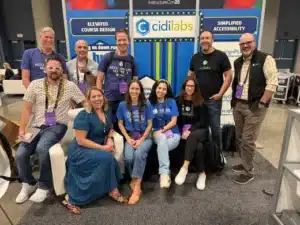 Members of the Cidi Labs team at InstructureCon posed in the booth